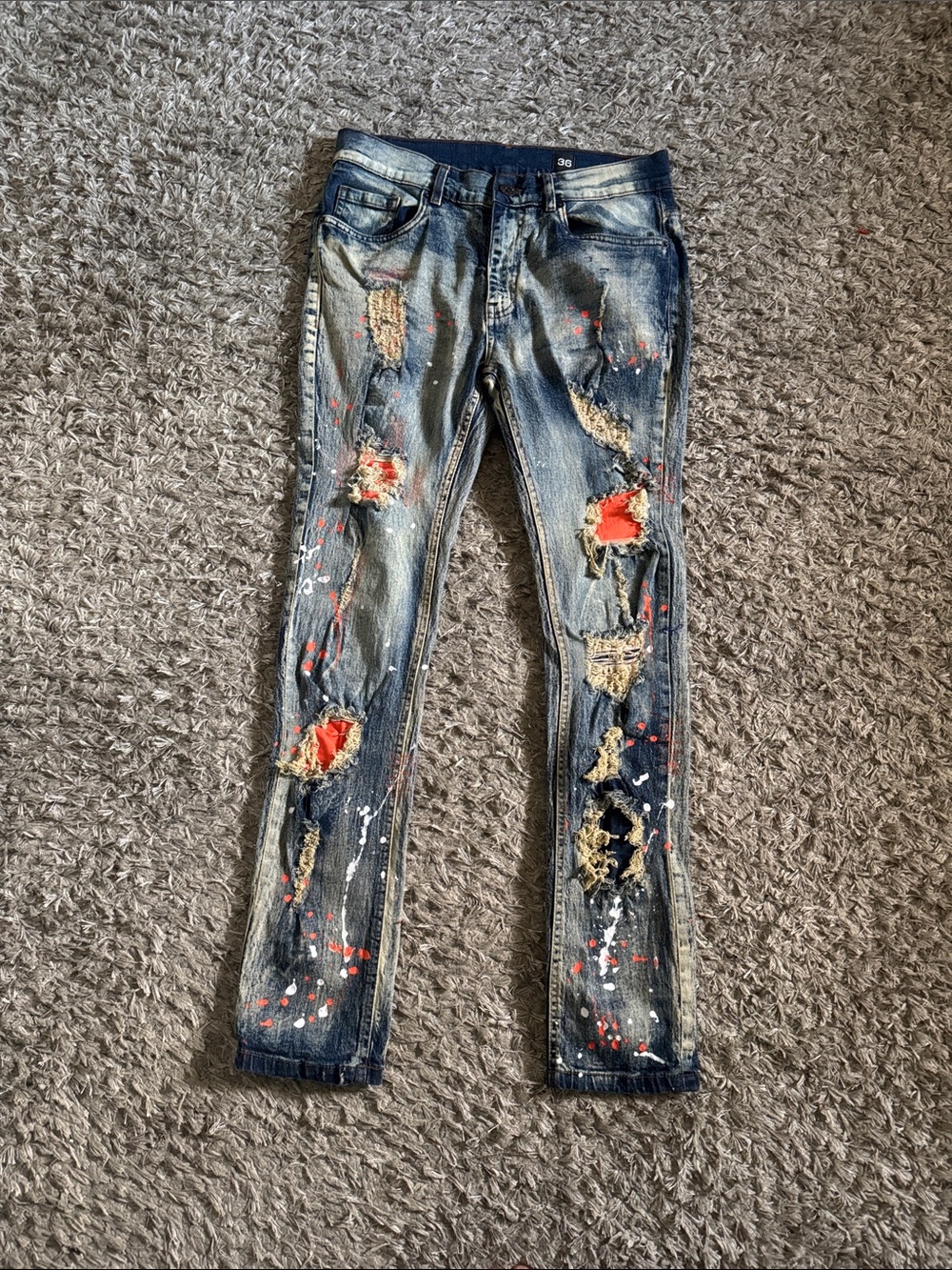 Skinny Distressed Blue Jeans with Orange Paint Patch Accents